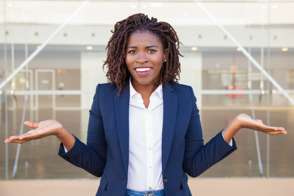 cheerful confused female manager posing outside